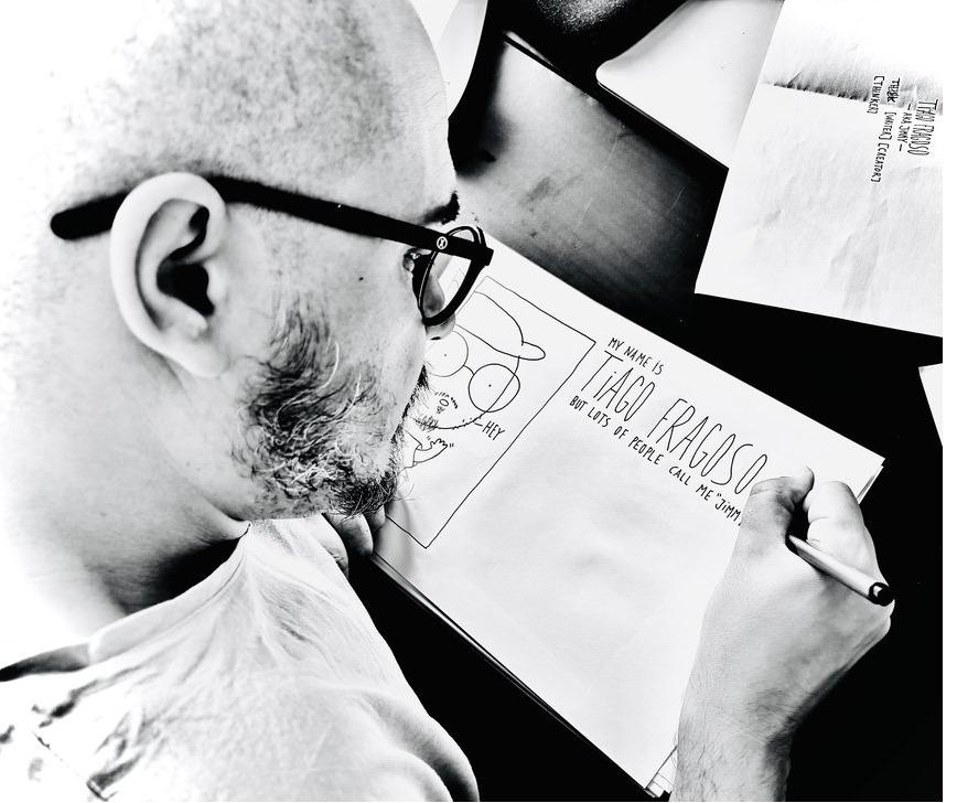 Tiago Fragoso drawing the website by hand